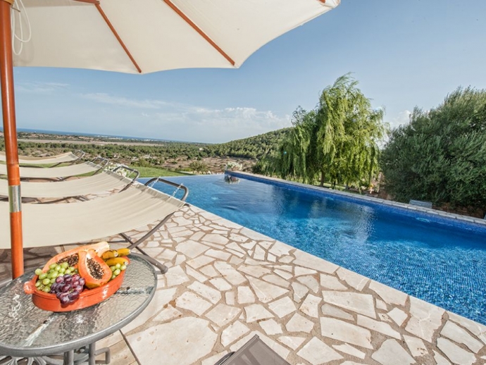 Pool area with Sunloungers and Umbrellas